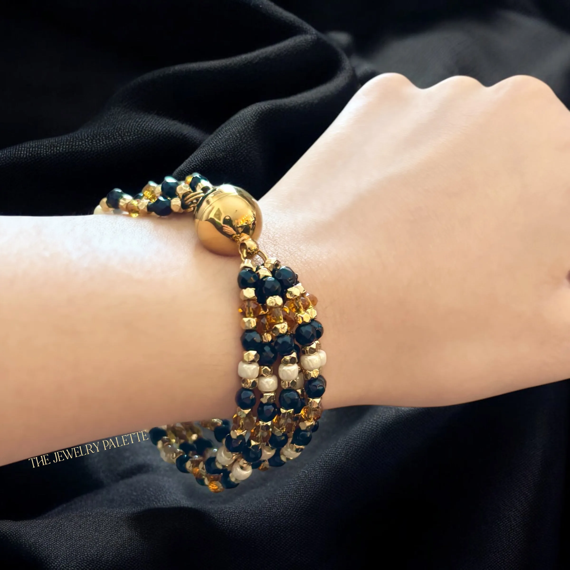 Hajr multitier black and gold bracelet